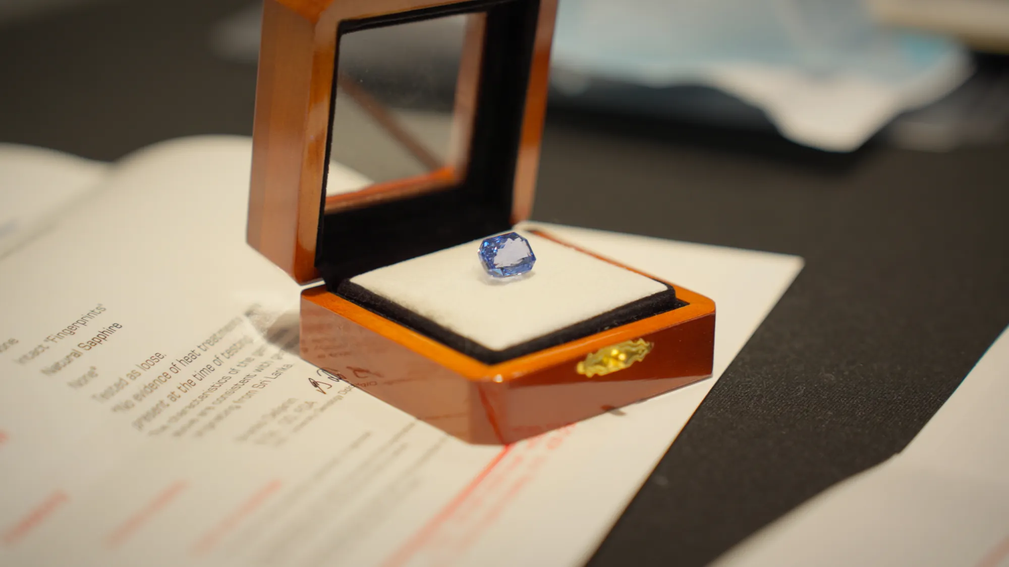 A Sri Lankan sapphire presented with its provenance report